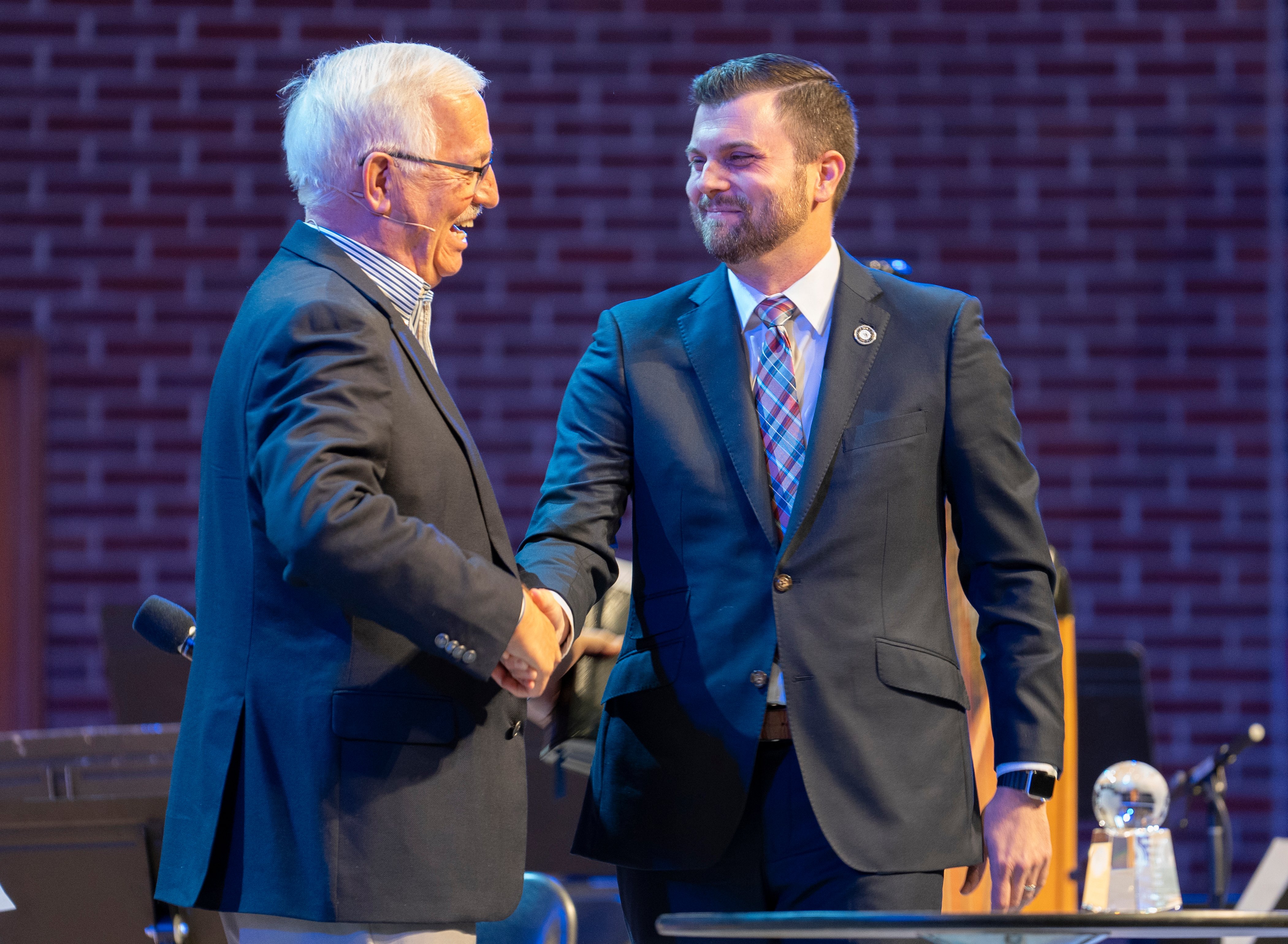 Jeff Bope (right), executive director of Moody’s Alumni Association (right), congratulates Dr. Dann Spader (left), founder of Concentric Global and Sonlife Ministries, at the 2024 Founder’s Week after being announced as the Alumnus of the Year.